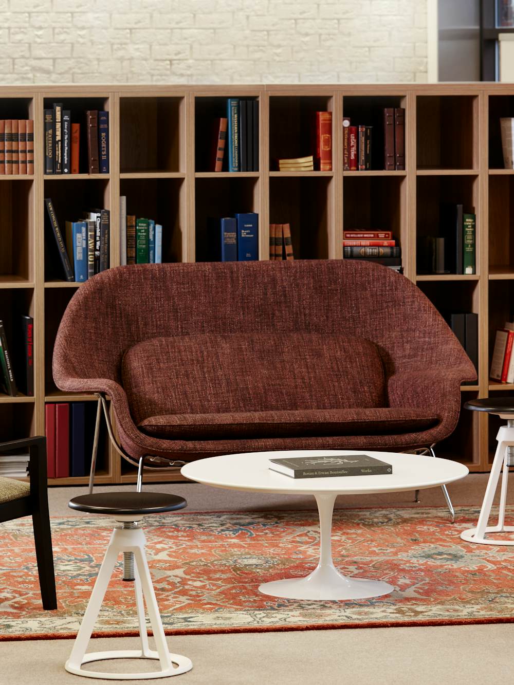 Knoll Essentials anchor storage open lockers Saarinen table Krusin lounge chair Womb settee Piton stool Saarinen Executive Armless chair Community Space Activity Space Library